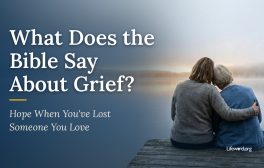 Two women sit close together on a wooden dock, one resting her head on the other's shoulder, looking out at a misty lake at dawn. Title card: What Does the Bible Say About Grief? Hope When You've Lost Someone You Love.