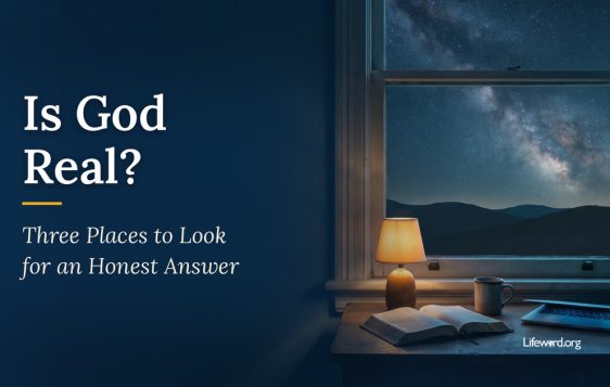 A lamp-lit desk at night with an open Bible, a mug and a laptop beside a window that looks out on a sky full of stars and the Milky Way. The title card reads Is God Real? Three Places to Look for an Honest Answer.