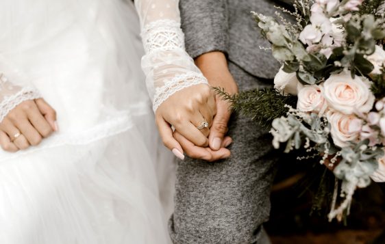 married couple holding hands
